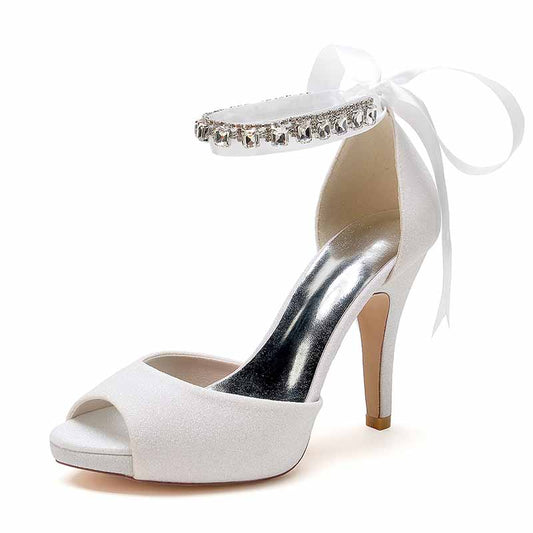 Elegant ankle strap bridal pumps with a sparkling embellishment and open toe design
