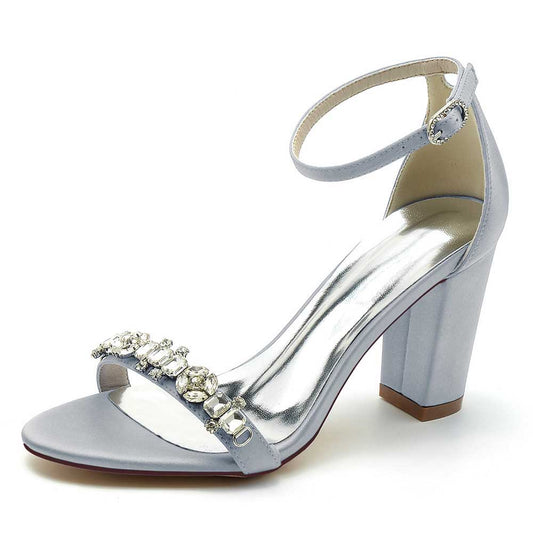 S&DCo. Elegant blue ankle strap dress sandals for weddings with jeweled embellishments