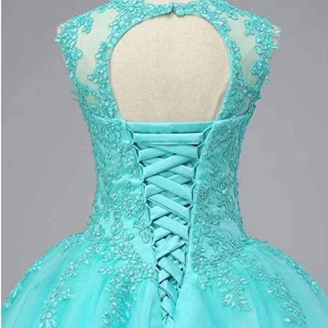 Back view of a turquoise beaded quinceanera dress featuring intricate embroidery and lace-up design