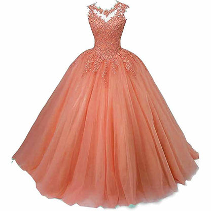 Elegant beaded quinceanera dresses in peach with a full tulle skirt and intricate detailing