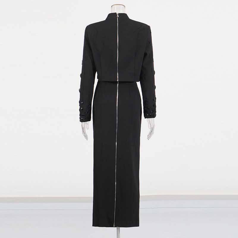 Back view of a beaded women's skirt suit in elegant black with tailored fit and detailed embellishments