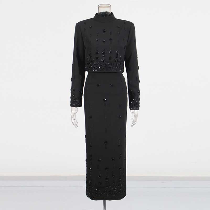 Elegant black beaded women's skirt suit with long sleeves and a fitted silhouette for formal occasions