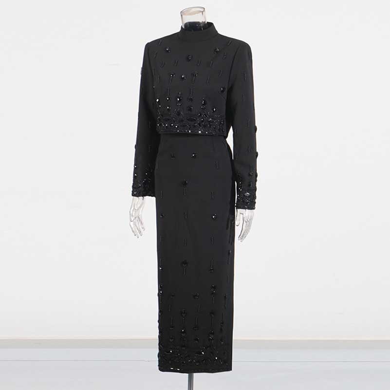 Elegant beaded women's skirt suit in black featuring long sleeves and intricate bead detailing