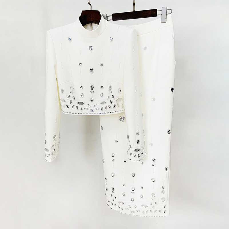 Elegant beaded women's skirt suit in white featuring stylish long sleeves and intricate detailing