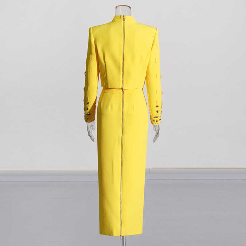 Stylish beaded women's skirt suit in vibrant yellow with long sleeves and a fitted silhouette
