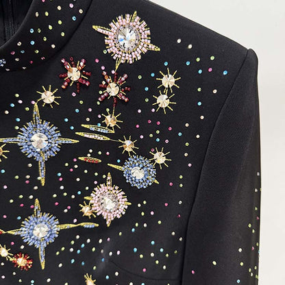 Close-up of a black beaded crystal mini dress featuring colorful beading and intricate designs