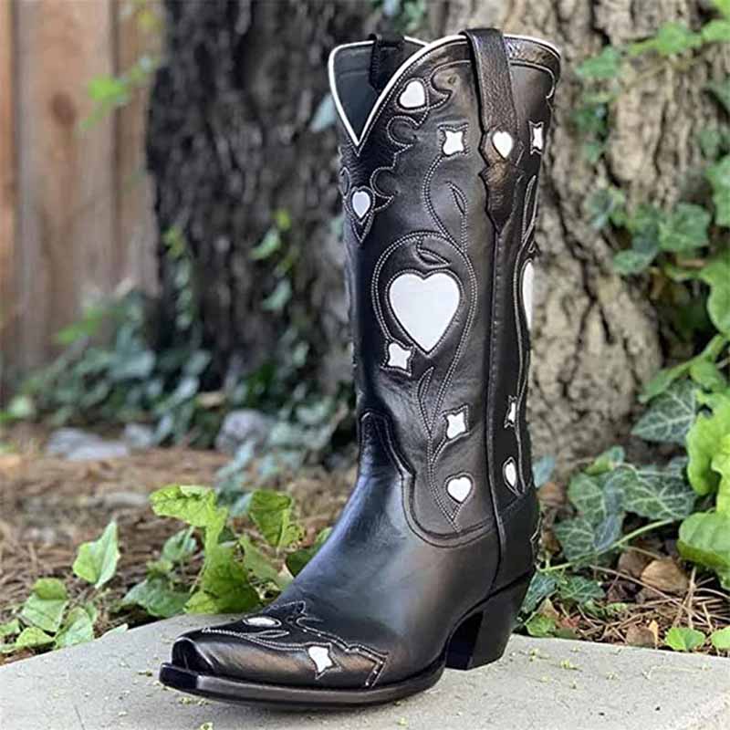 Black embroidered cowgirl boots for women featuring intricate heart designs and stylish western flair