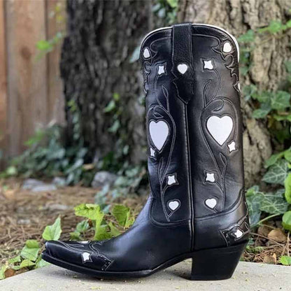 Stylish black embroidered cowgirl boots for women featuring heart designs and a sleek pointed toe