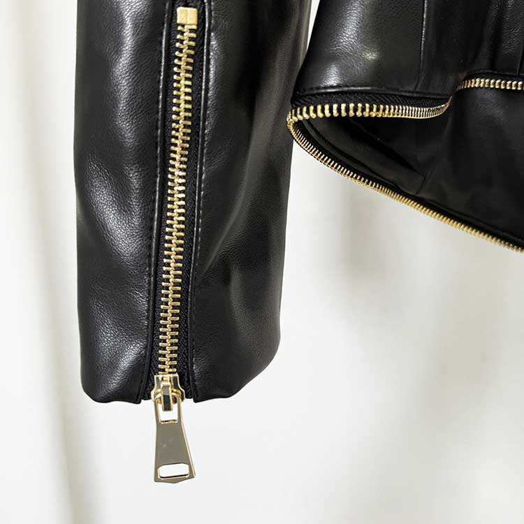 Close-up of a black fitted leather jacket with zippers showcasing premium quality and stylish design