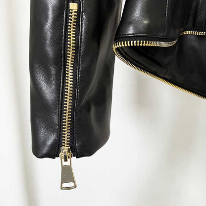 Close-up of a black fitted leather jacket with zippers showcasing premium quality and stylish design