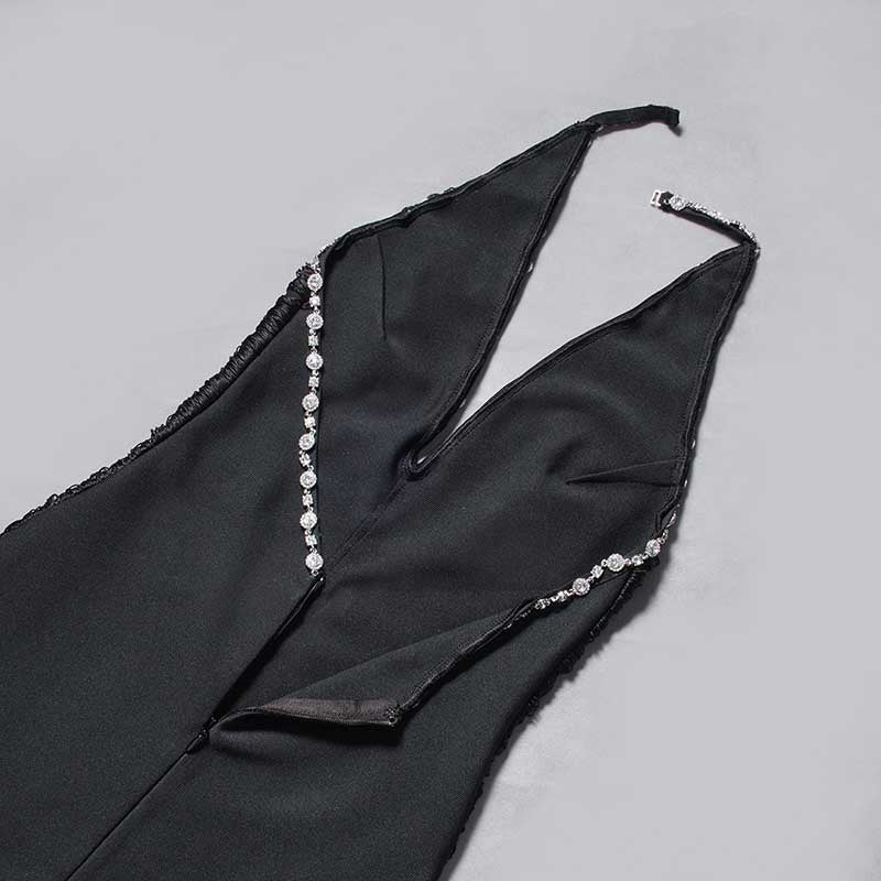 Black halter neck rhinestone dress featuring elegant detailing and a sleek design