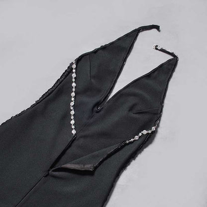 Black halter neck rhinestone dress featuring elegant detailing and a sleek design
