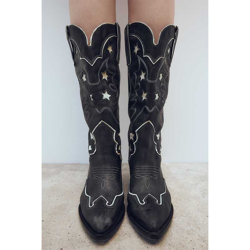 Black star embroidered cowboy boots with elegant stitching and unique design for style and comfort