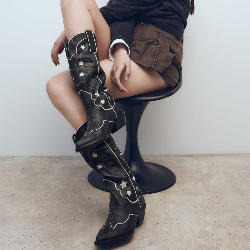Stylish black star embroidered cowboy boots with eye-catching design perfect for fashion-forward outfits