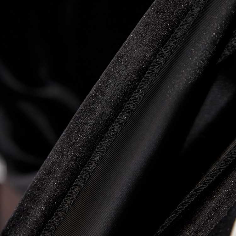 Close-up of luxurious black velvet fabric showcasing the elegant texture of the black velvet pantsuit for women