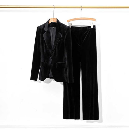 Elegant black velvet pantsuit for women featuring a tailored blazer and matching trousers