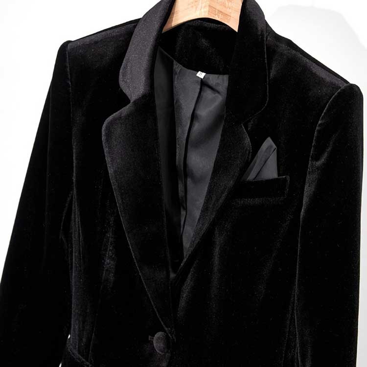 Elegant black velvet pantsuit for women, featuring a sleek design and classic lapel detail