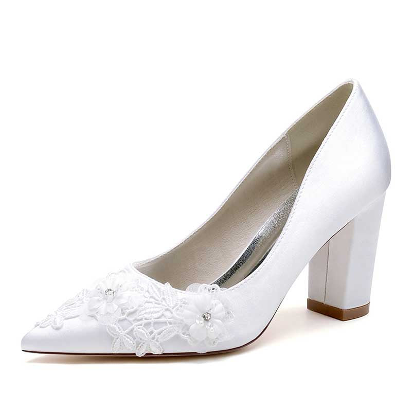 Elegant white block heel bridal shoes with flower appliqué for a stylish wedding look