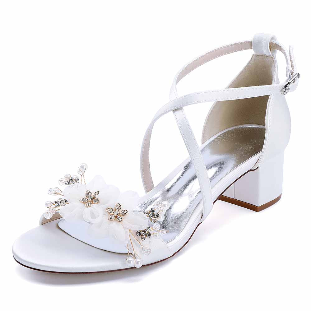 Elegant block heel wedding sandals with floral embellishments and crisscross straps