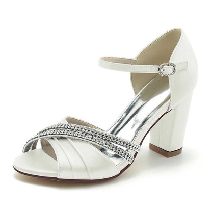 S&DCo. Block heel wedding sandals in white satin with rhinestone accents for stylish bridal footwear
