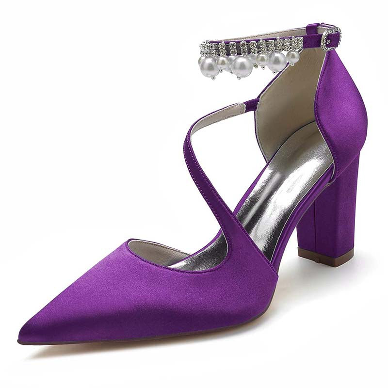 Purple high-heeled shoe with pearl embellishments on a white background