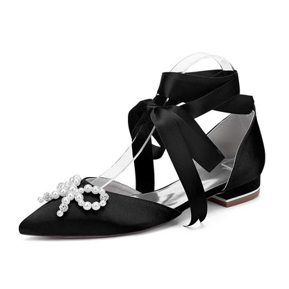 Elegant bridal ankle strap flat shoes in black satin with pearl embellishments and ribbon ties