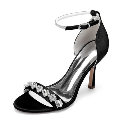 Elegant black bridal ankle strap heels with embellished details and a sleek stiletto heel