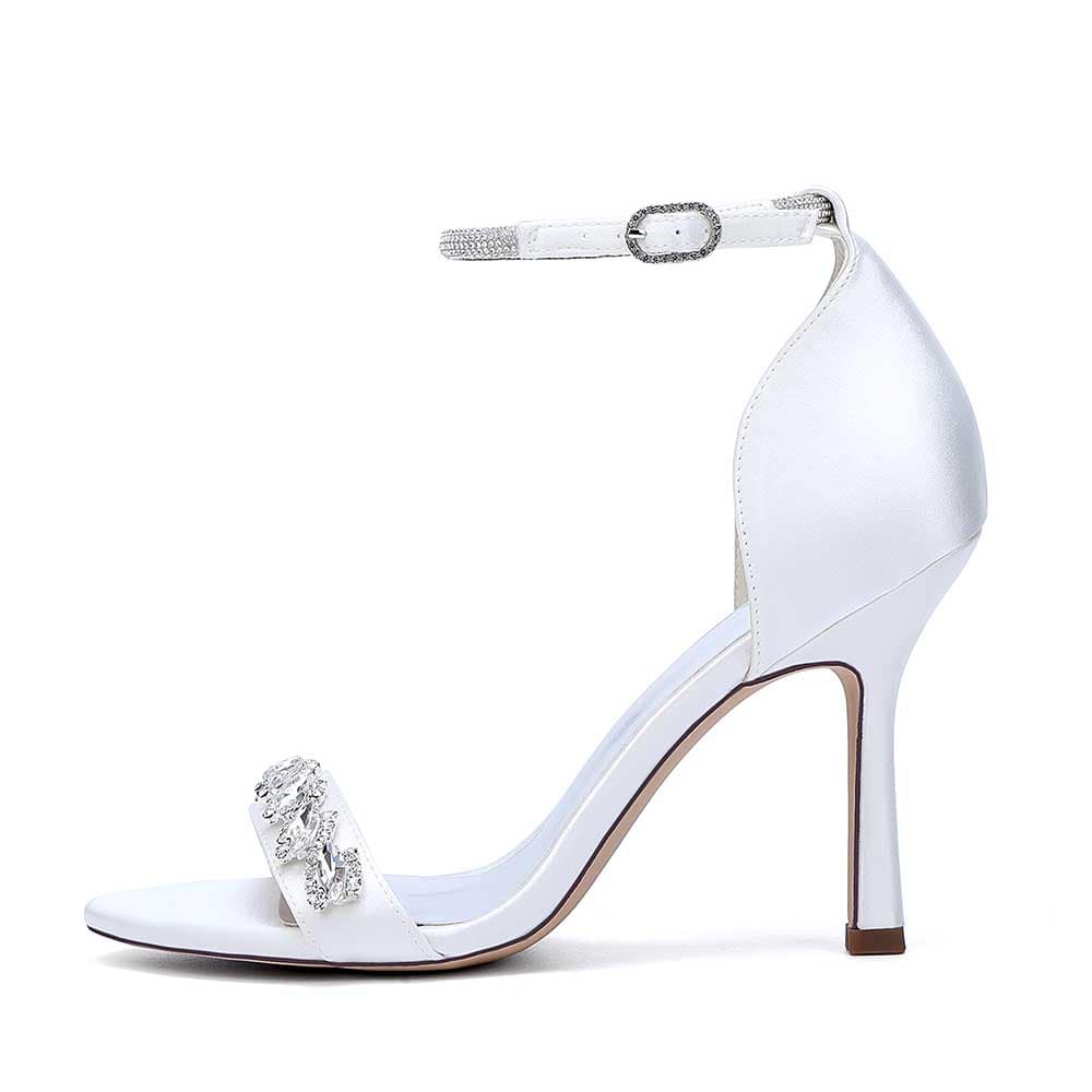 Elegant white bridal ankle strap heels with a sparkling embellishment for special occasions