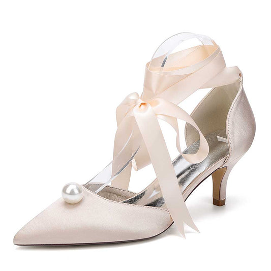 Bridal ankle strap heels with pearls featuring delicate ribbons and a pointed toe design