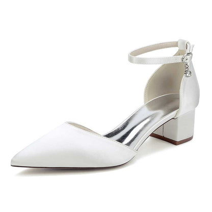 Elegant white bridal ankle strap wedding shoes with a pointed toe and block heel for special occasions