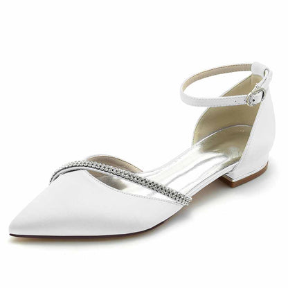 Elegant pointed toe satin bridal flats with an ankle strap and beaded embellishments for a chic wedding look