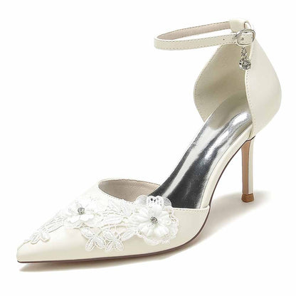 Elegant bridal heels with ankle strap featuring floral lace details and a pointed toe design