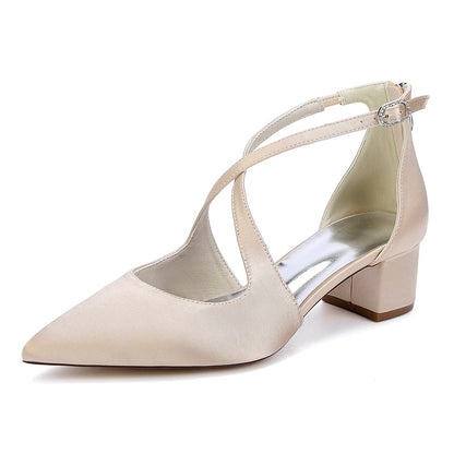 Elegant nude bridal heels with crossing straps and a comfortable block heel design