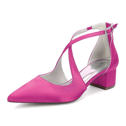 Pink bridal heels with crossing straps and block heel design for elegant weddings