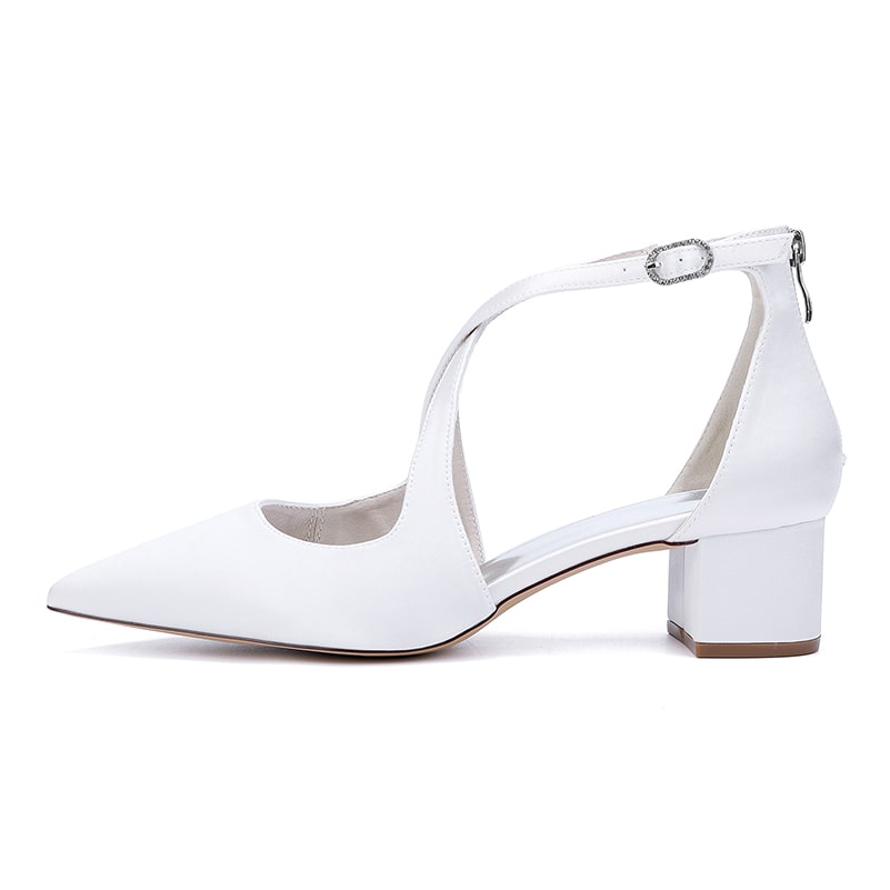 Elegant white bridal heels with crossing straps and block heel for comfort and style