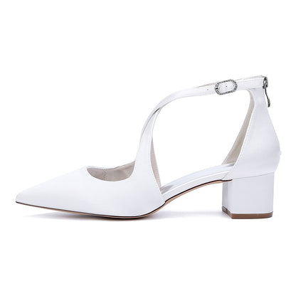 Elegant white bridal heels with crossing straps and block heel for comfort and style