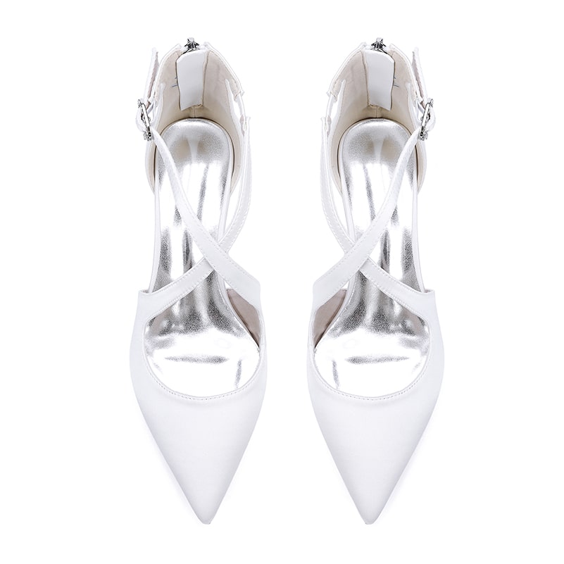 Elegant white bridal heels with crossing straps and pointed toes for wedding occasions