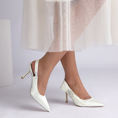 Elegant bridal heels with rhinestone embellishment, featuring a sleek design and stylish slingback detail.