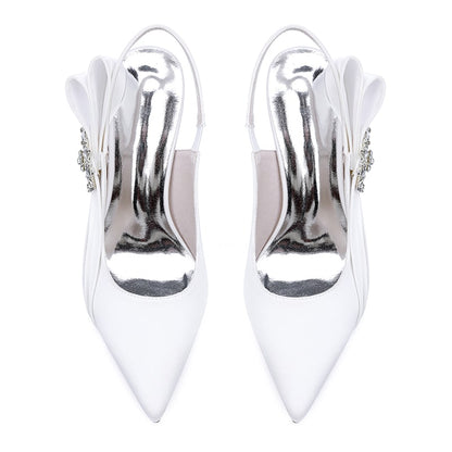 Elegant bridal heels with rhinestone embellishment featuring a sleek white design and pointed toe
