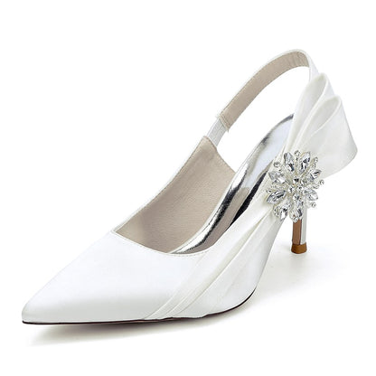 Elegant white bridal heels with rhinestone embellishment and a stylish slingback design