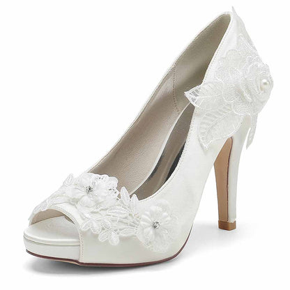 Elegant bridal lace peep toe stiletto heels by S&DCo with floral embellishments for weddings