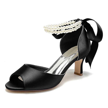 Elegant low heel satin bridal shoes in black with pearl ankle detail and open toe design