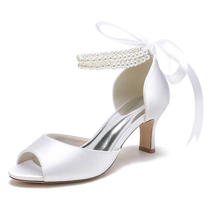 Elegant low heel satin bridal shoes with ankle strap adorned with pearls for stylish brides