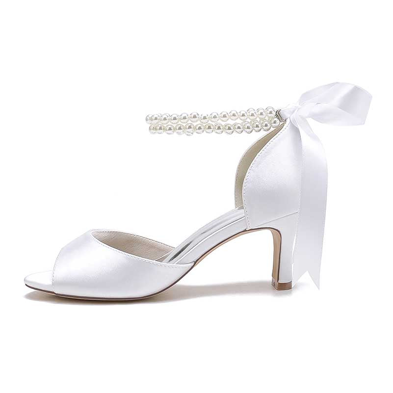 Low heel satin bridal shoes with pearl ankle strap and ribbon detail for elegant wedding style