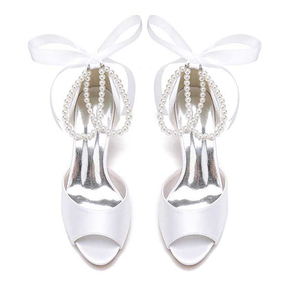 S&DCo. low heel satin bridal shoes with a open toe design and pearl accents for weddings