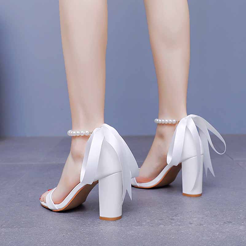 Elegant bridal pearl ankle strap chunky heels with ribbon detail for wedding occasions