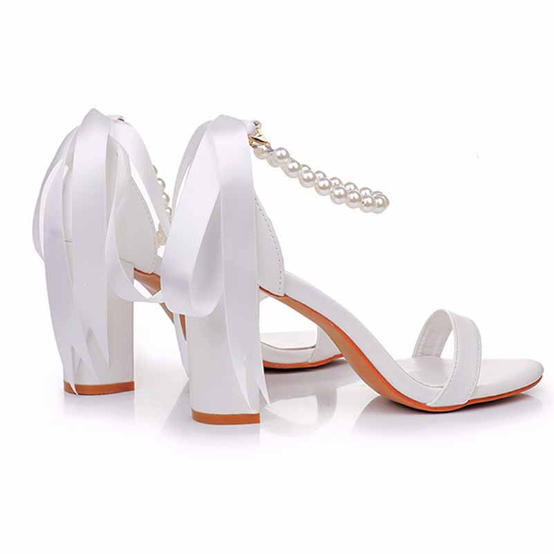 Elegant bridal pearl ankle strap chunky heels by S&DCo with stylish ribbon accents