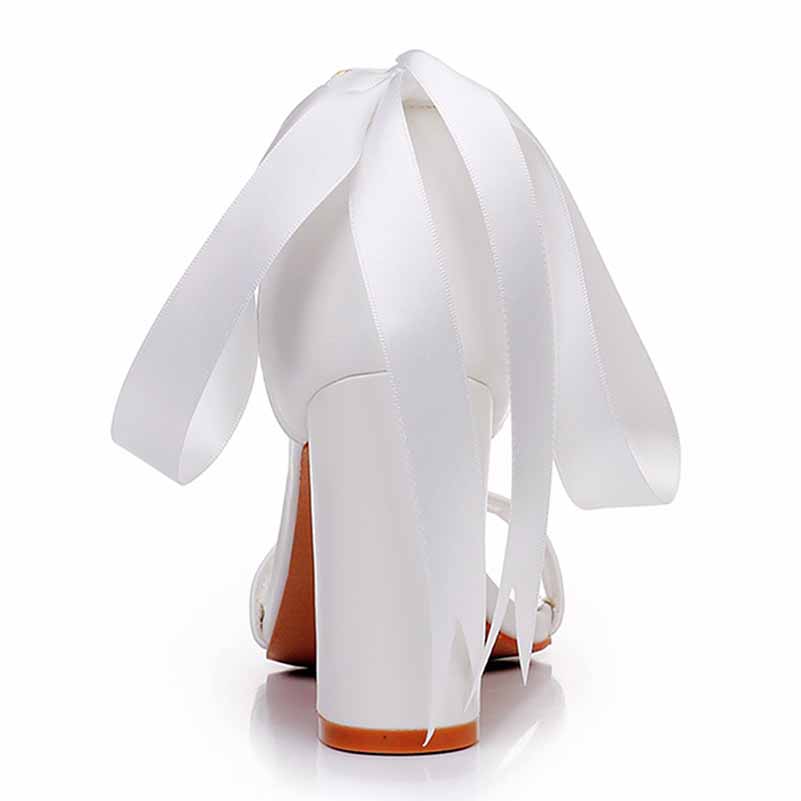 Bridal pearl ankle strap chunky heels with elegant white ribbons for a stunning wedding look