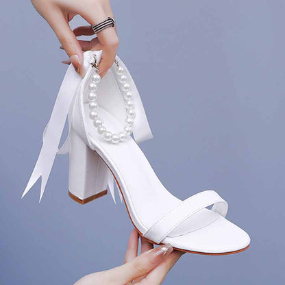 Bridal pearl ankle strap chunky heels in white with elegant ribbon details