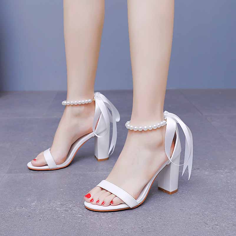 Elegant bridal pearl ankle strap chunky heels in white with ribbon ties for special occasions